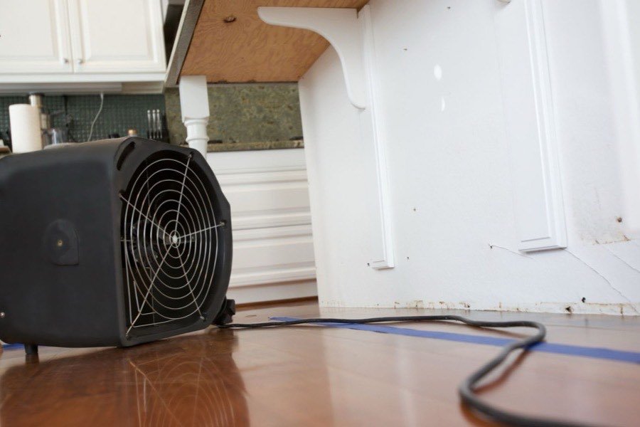 Air mover running in a kitchen after an appliance leak