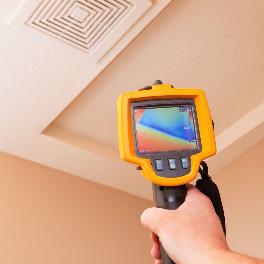 PDX Restoration technician scanning a ceiling with a thermal imaging camera